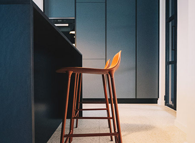 Cucina moderna con sgabelli arancioni davanti a isola nera.